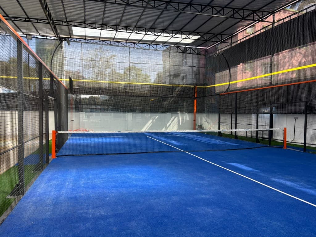 Covered glass-walled padel court at Padel Haus Arena, Salunkhe Vihar, Pune